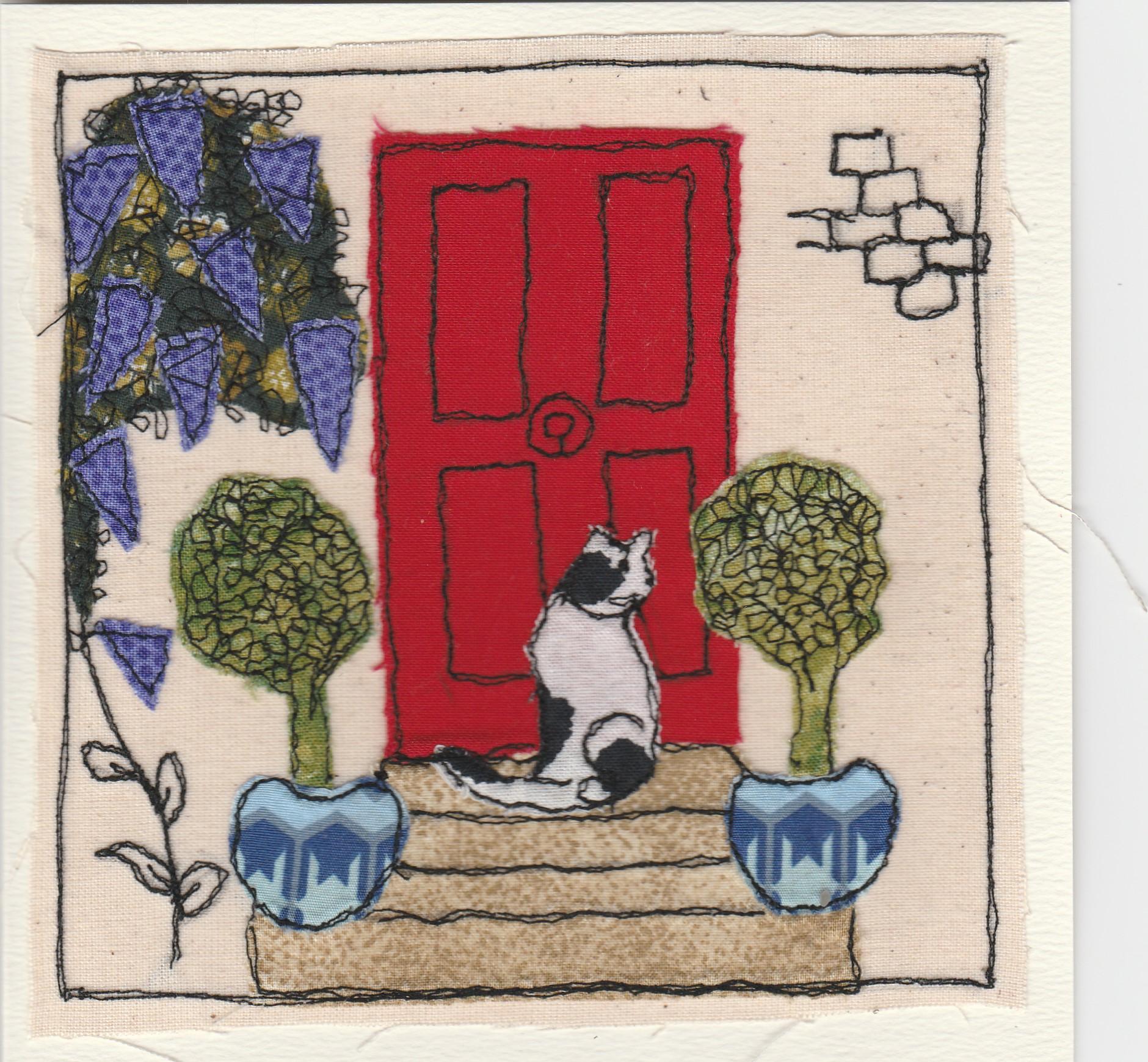 Freehand machine sewn gift card with pisture of cat at front door