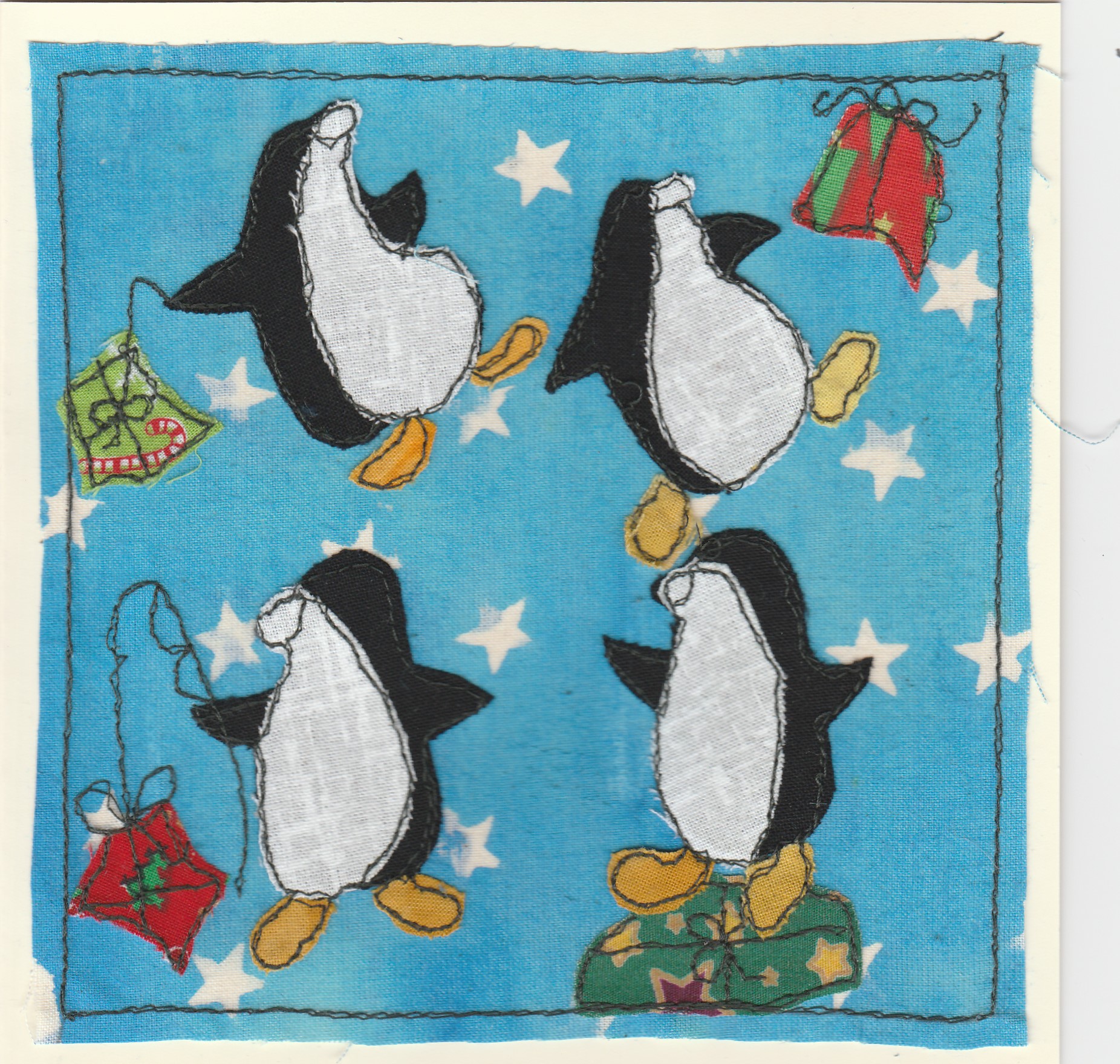 Freehand machine sewn gift card with picture of four penguins