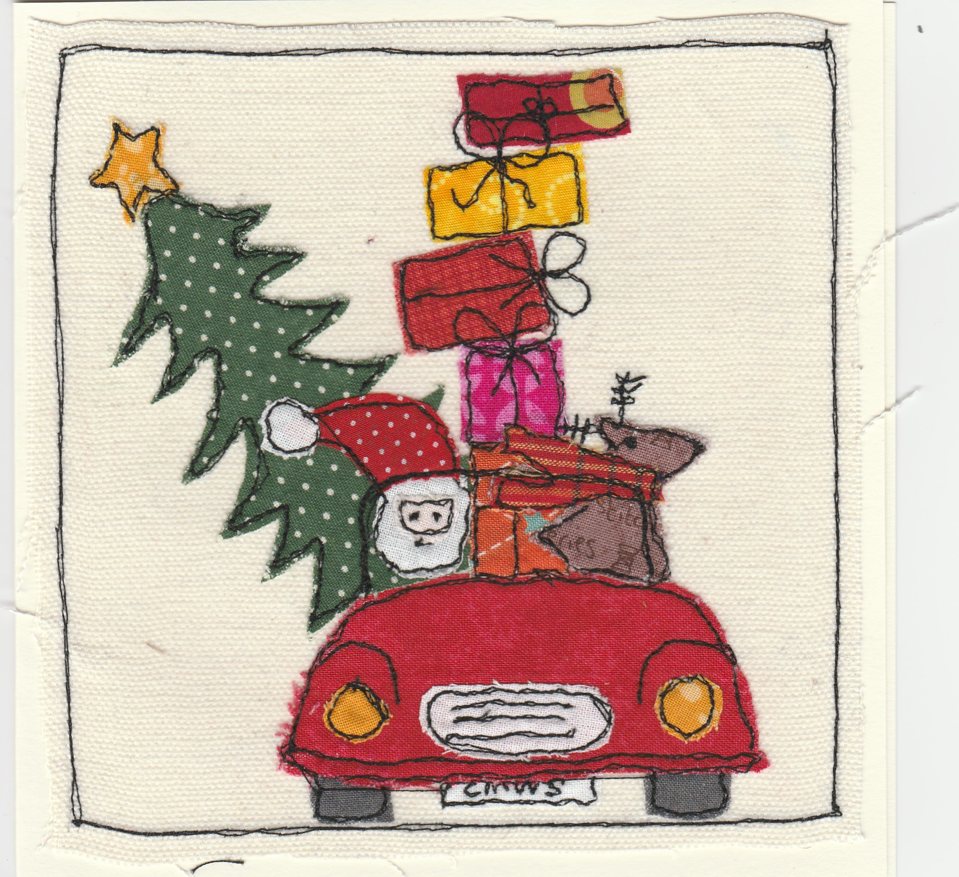 Freehand machine sewn christmas card with car overloaded with christmas tree and presents