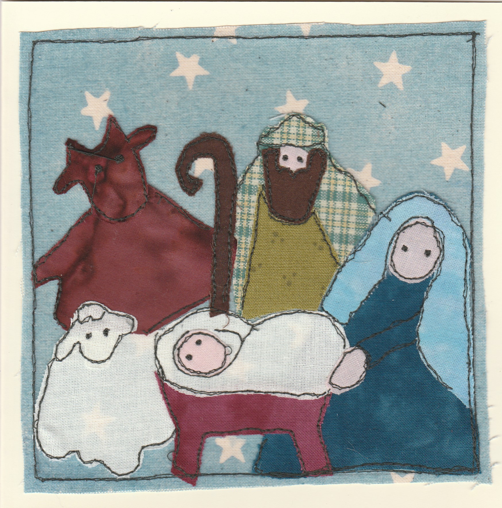 Freehand machine sewn christmas card showing nativity scene