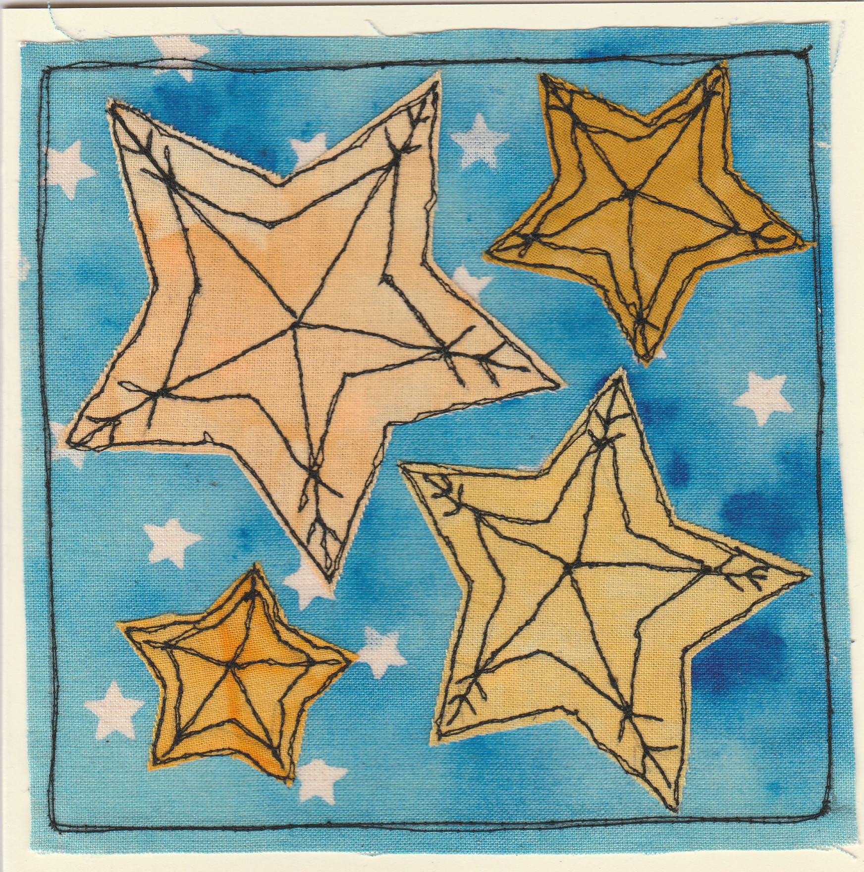 Freehand machine sewn christmas card with stars on night sky background