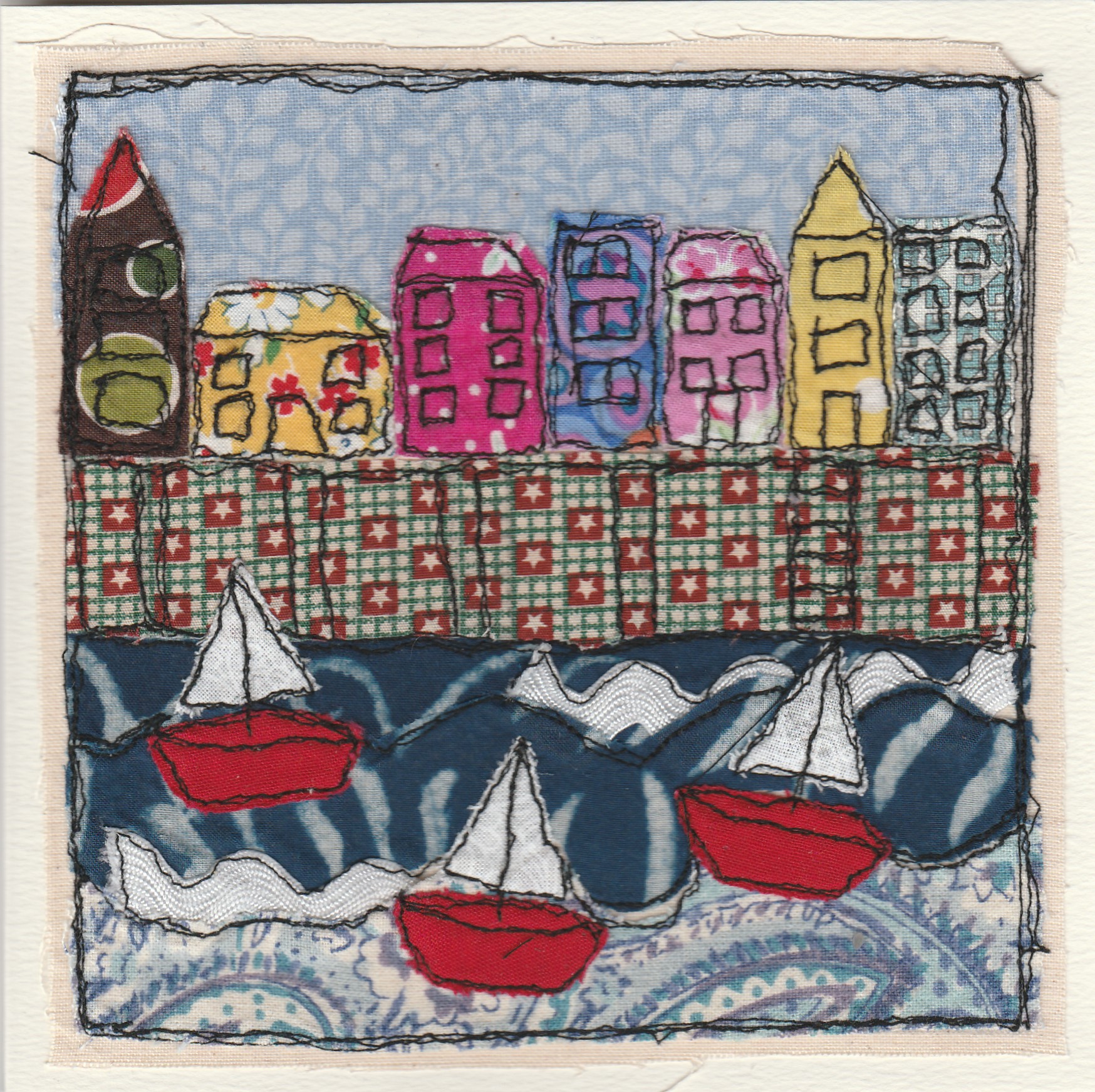 Freehand machine sewn gift card with boats in a harbour