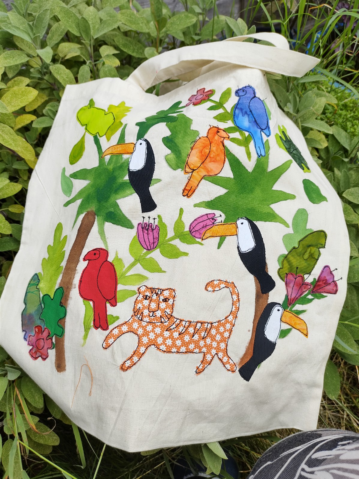 Tote bag with freehand machine sewn jungle design.